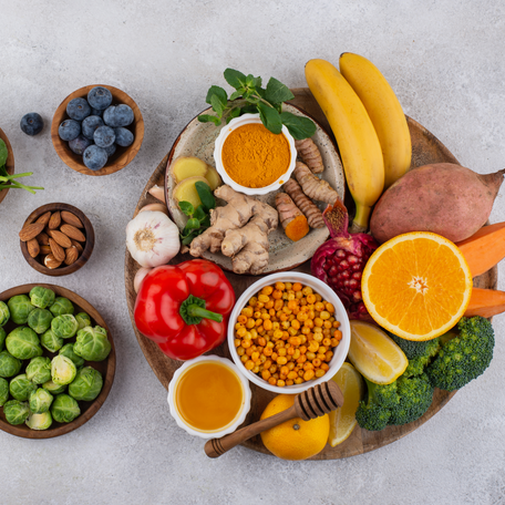 A colorful assortment of fresh fruits and vegetables in a bowl, representing a healthy, nutrient-rich diet.