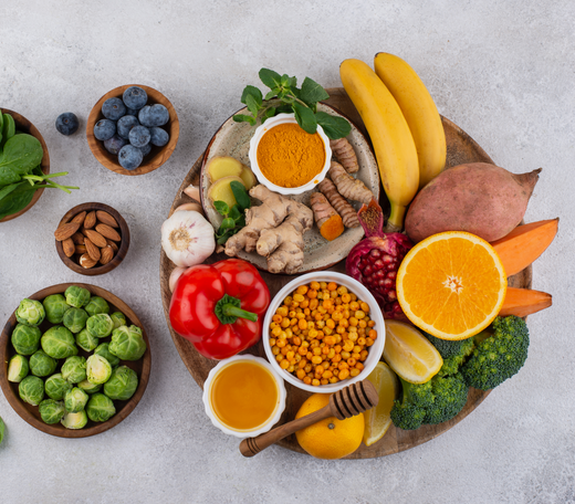 A colorful assortment of fresh fruits and vegetables in a bowl, representing a healthy, nutrient-rich diet.